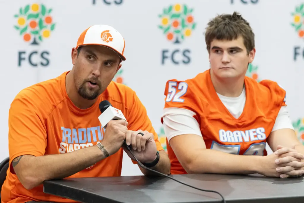 Boone High School coach Charles Sprenkel answers interview questions during...