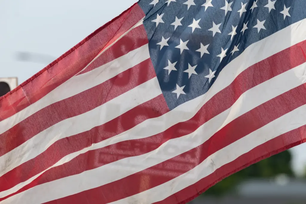 An American flag waves during the Stop Ice Terror National...