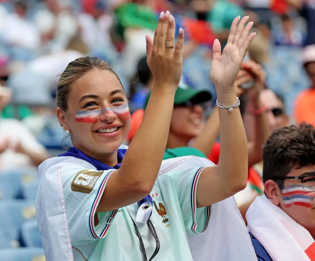 Foxboro, MA – July 9 – A French fan celebrates...