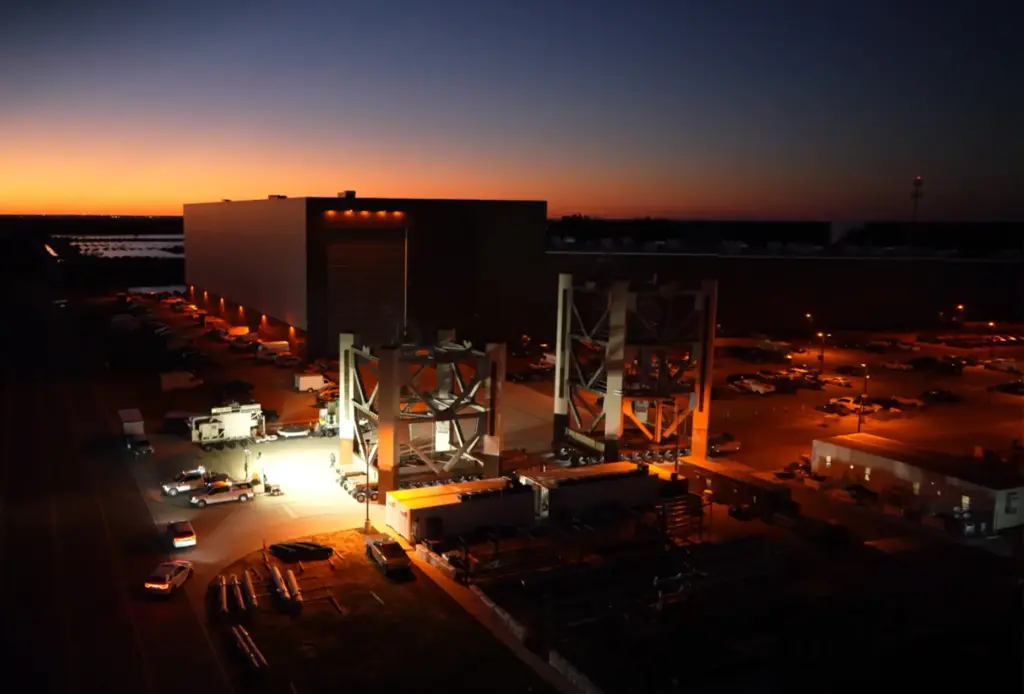 Steel trusses sit in front of SpaceX's facilities at Kennedy...