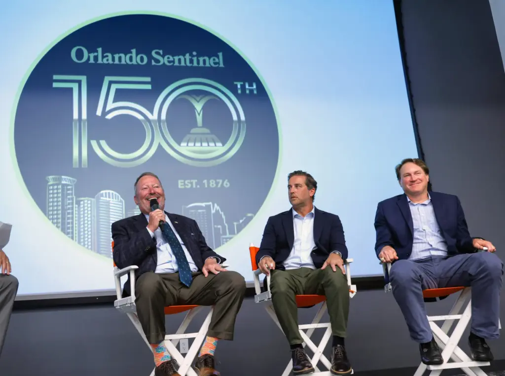 DISCUSSING DOWNTOWN â Orlando mayor Buddy Dyer, left, answers a...