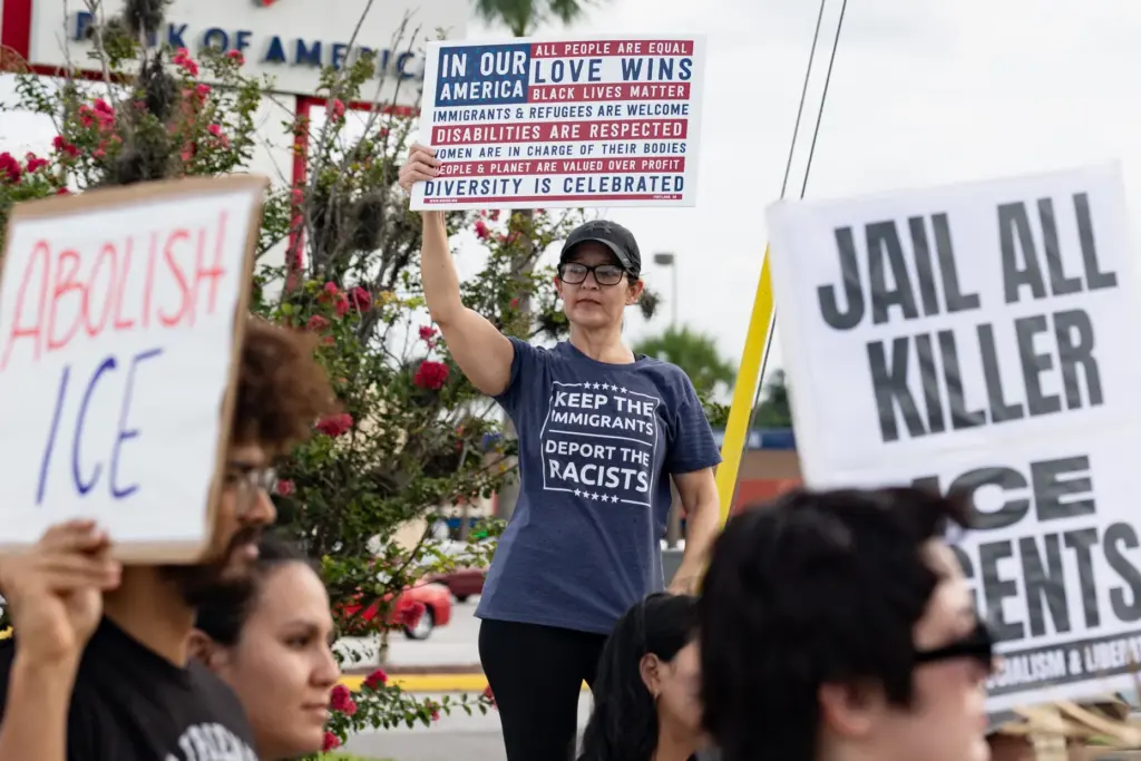 Protester holds a sign during the Stop Ice Terror National...
