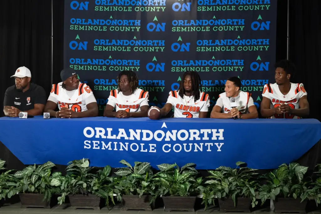 Players from Seminole High School answer questions during varsity media...
