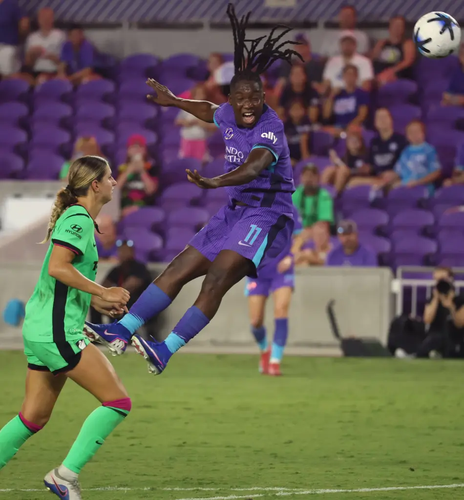 Orlando player Barbra Banda (top) leaps for a header during...