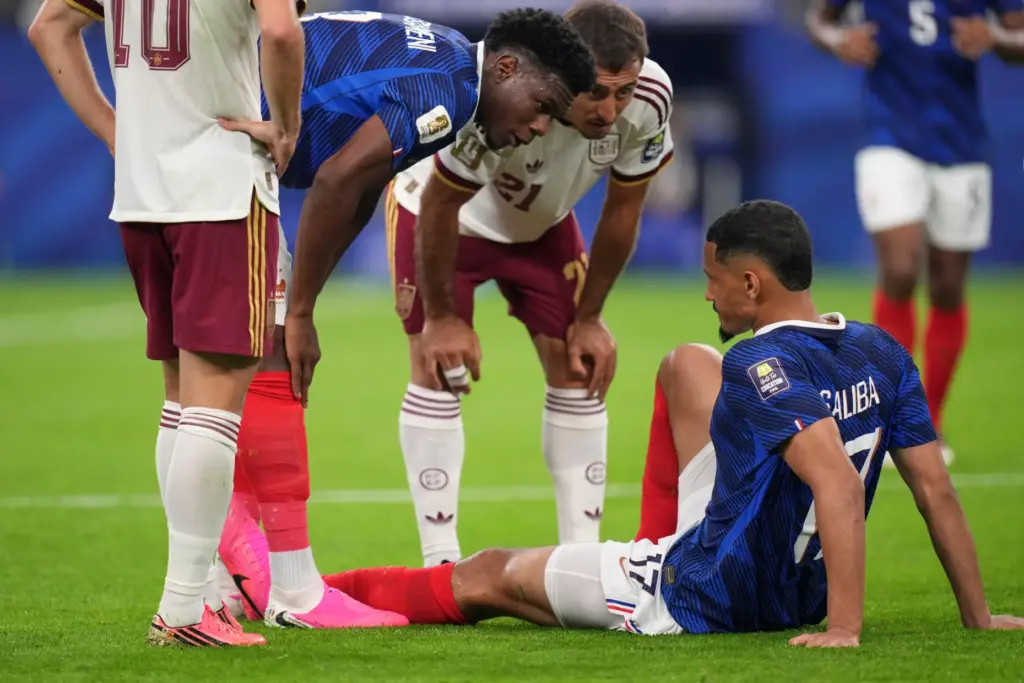 France’s William Saliba (17) is checked on by France’s Aurelien...