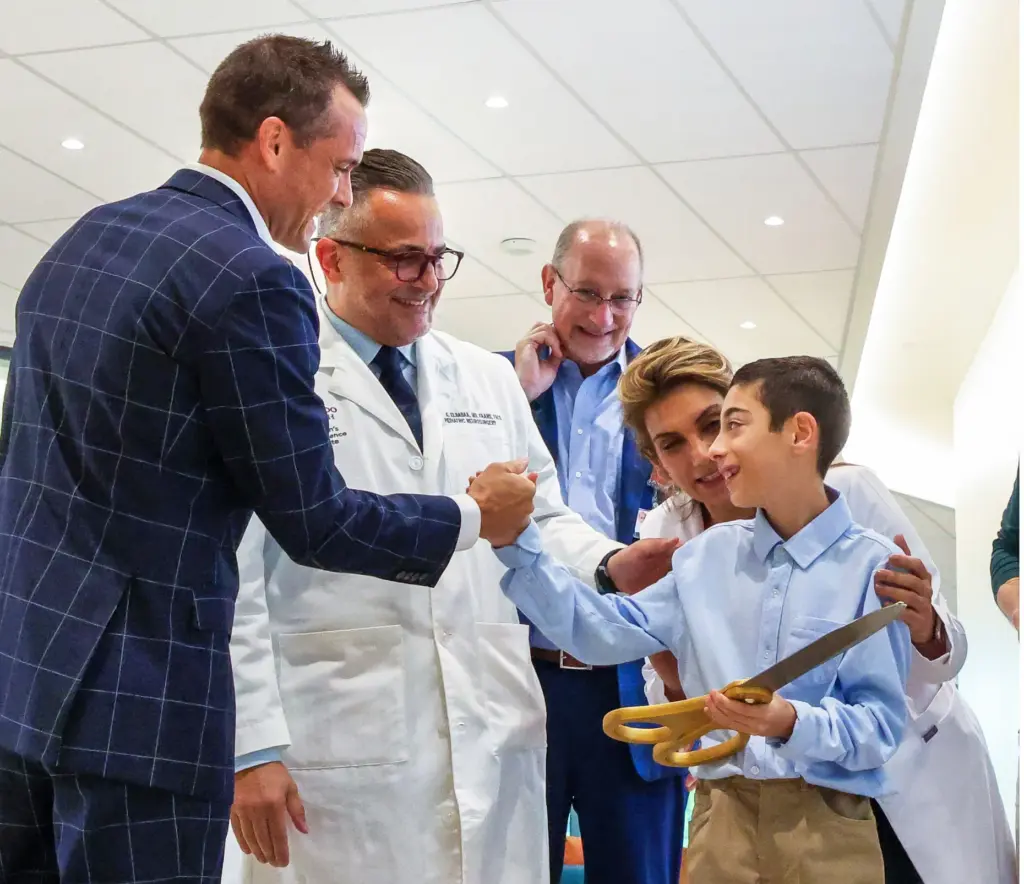 Orlando Health senior vice president Justin Williams, left; Chief of...