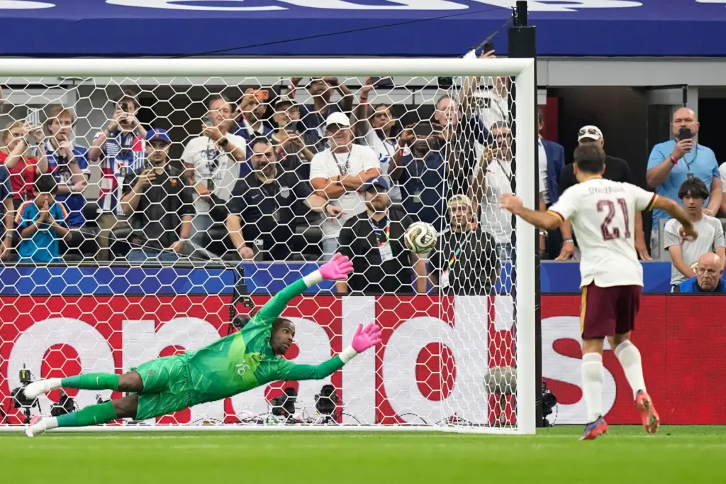 Spain’s Mikel Oyarzabal scores the opening goal from the penalty...