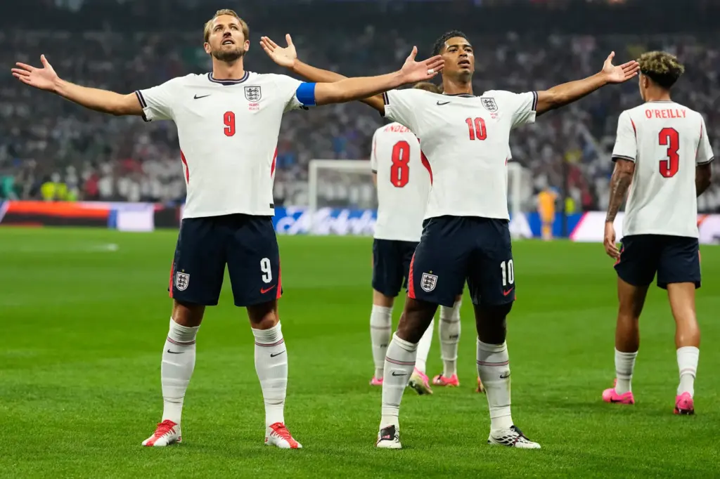England’s Jude Bellingham (10) celebrates with teammate Harry Kane (9)...