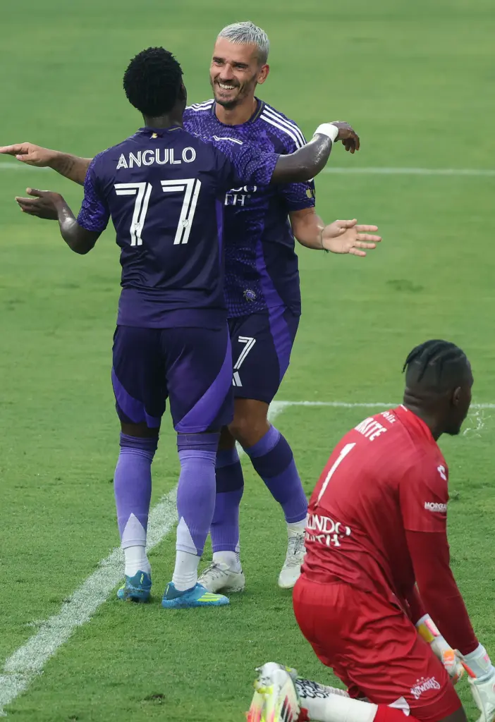 Orlando City players Ivan Angulo (77) and Antoine Griezmann (7)...