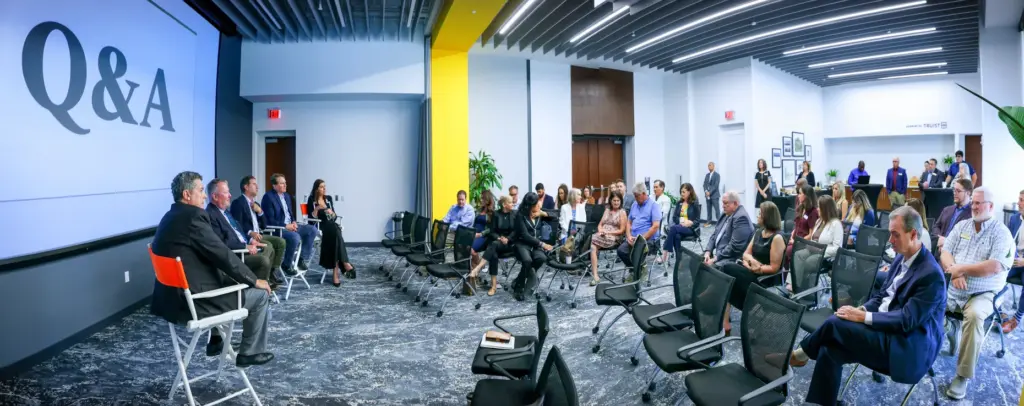 DISCUSSING DOWNTOWN â Panelists listen to a question during the...