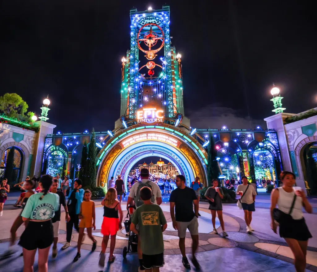 Guests watch the debut of the first nighttime finale fireworks...