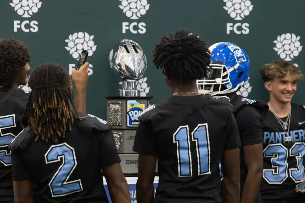 Players from Doctor Phillips High School take pictures with the...