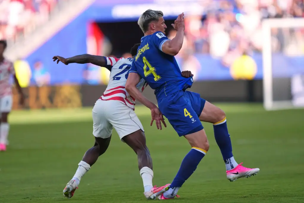Folarin Balogun puts his foot down on Bosnia's Tarik Muharemovic.