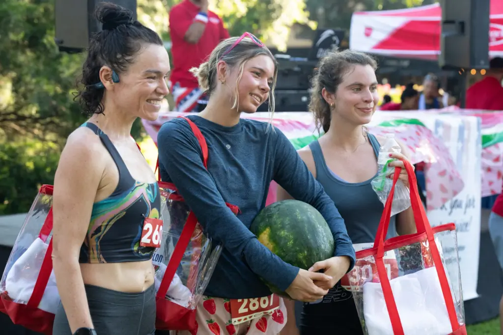 The first females to finish the race, from left to...