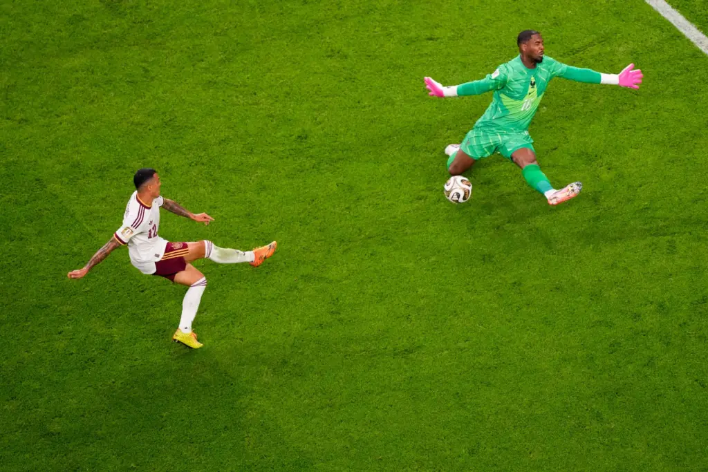 Spain’s Pedro Porro (12) scores their second goal as France...
