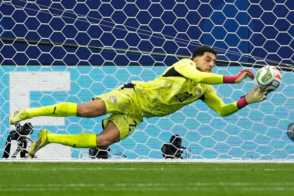 Argentina’s Lionel Messi (10) fails to score from a penalty...
