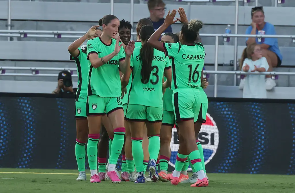 Boston players celebrate after the only goal of the match...