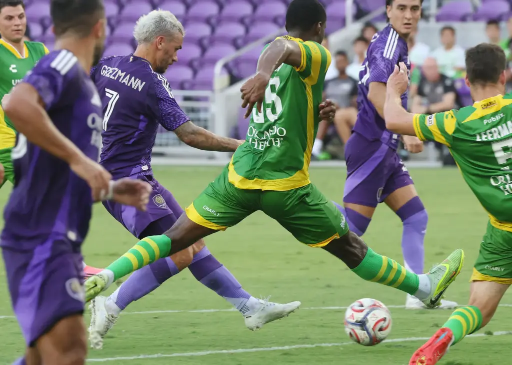 Orlando City player Antoine Griezmann (7) scores a goal between...