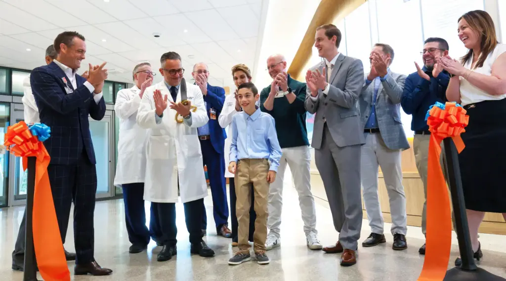 Orlando Health senior vice president Justin Williams, left, and Chief...