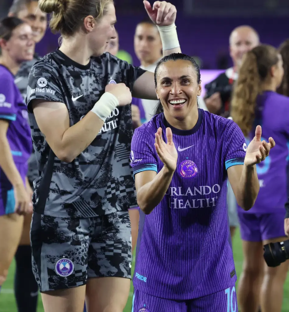 Orlando players Marta (right) and Anna Moorhouse (left) celebrate after...