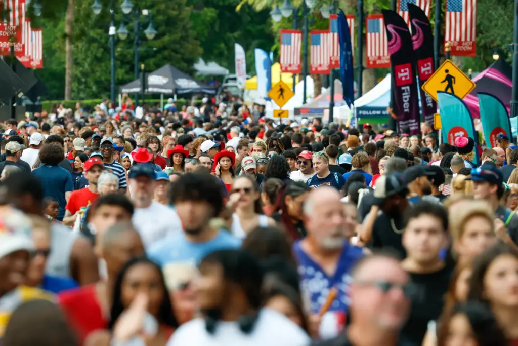 Red, Hot and Boom attendees wander through Cranes Roost Park...