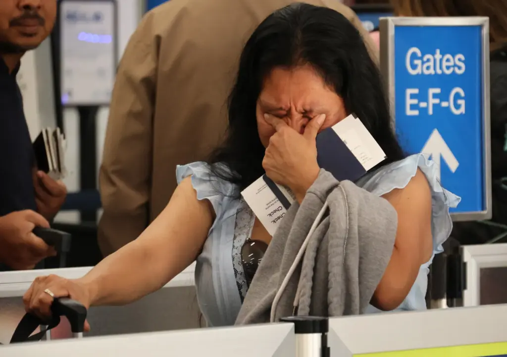 Olga Perez, longtime translator for the Guatemala Maya Center in Lake Worth Beach, prepares to board a flight to Guatemala City on Monday at Fort Lauderdale-Hollywood International Airport. A refugee from violence in her country decades ago, she self-deported after being detained by ICE. (Joe Cavaretta/South Florida Sun Sentinel)