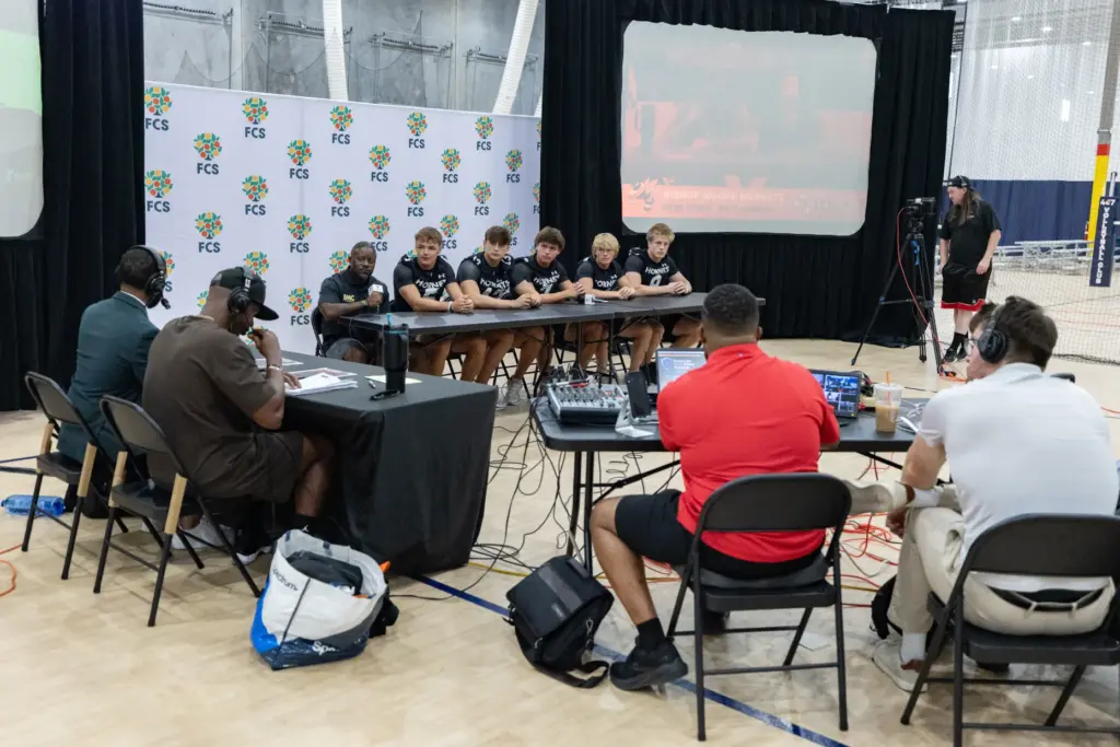 Bishop Moore High School coach Micah J. Davis and players...