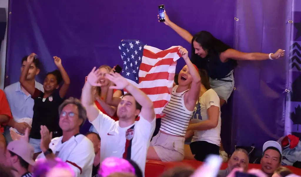 USA soccer fans cheer after a USA goal during a...