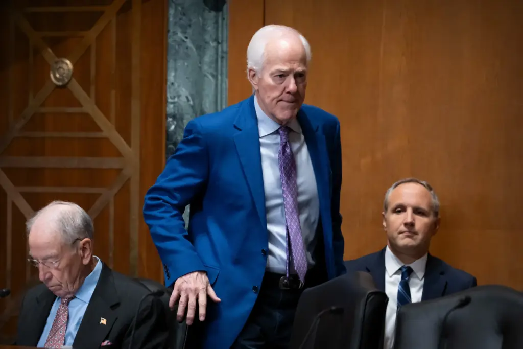 Sen. John Cornyn, R-Texas, arrives for a hearing of the Senate Finance Committee.