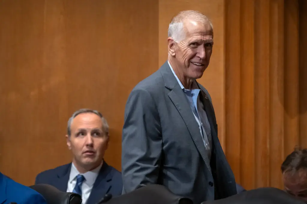 Sen. Thom Tillis, R-N.C., arrives for a hearing of the Senate Finance Committee.
