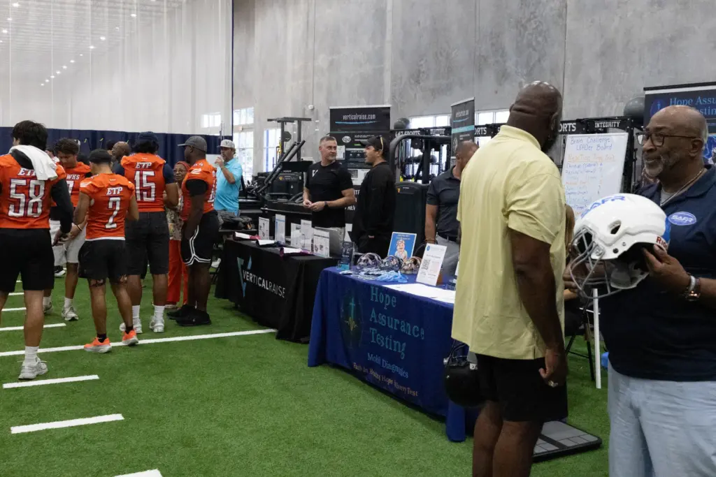 Sponsor tables during the varsity media day for high school...