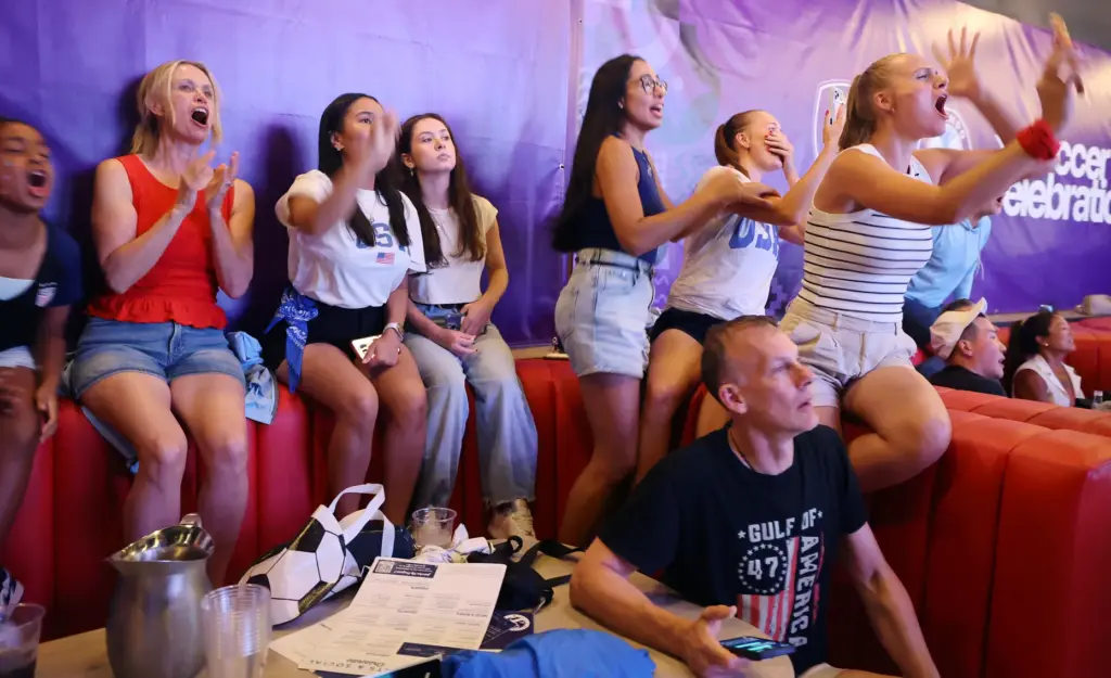 USA soccer fans are disappointed after a missed opportunity during...