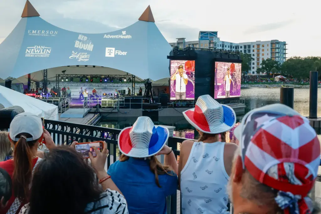Red, Hot and Boom attendees listen as singer-songwriter Chris Lane...