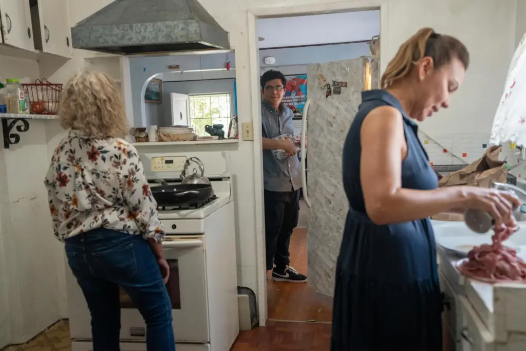 Damian ZermeÃ±o helps his aunts make lunch at his home.