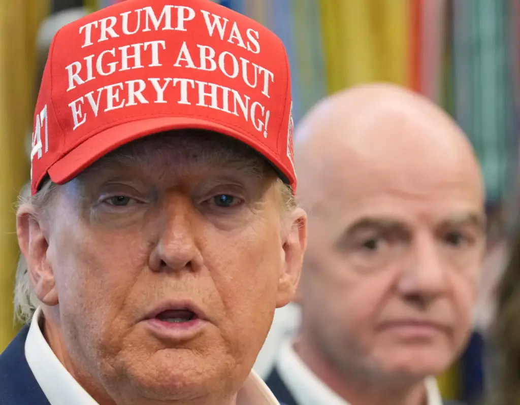 FILE – President Donald Trump speaks as FIFA President Gianni...