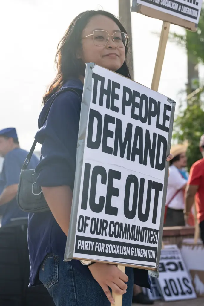 Protester holds a sign during the Stop Ice Terror National...