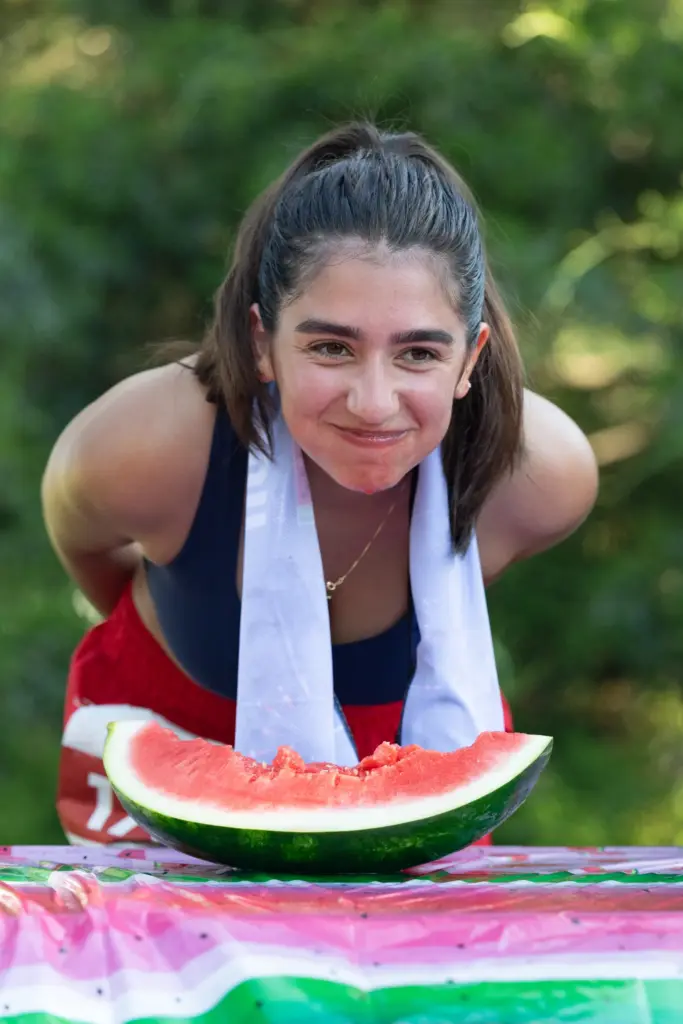 2nd place winner of the watermelon eating contest Mia smiles...