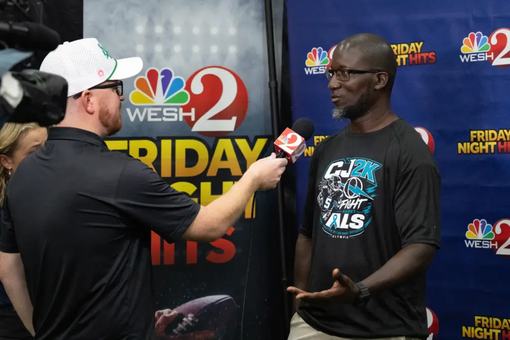 Olympia High School coach Travis Gabriel interviews with WESH2 during...