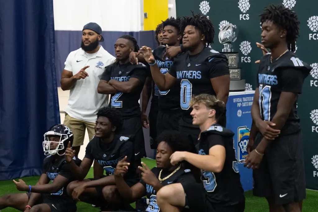 Players from Doctor Phillips High School take a picture with...