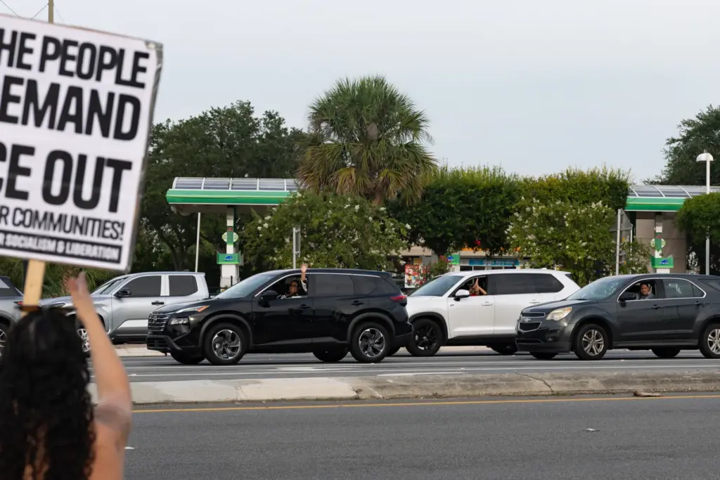 Drivers honk in support during the Stop Ice Terror National...