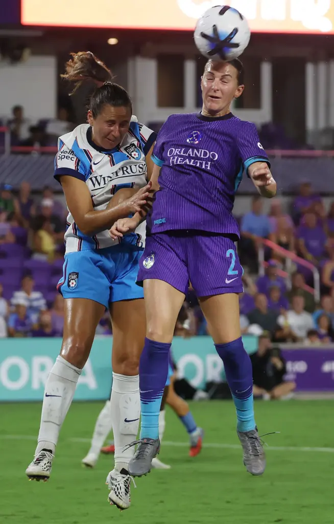 Orlando player Haley McCutcheon (2) heads the ball during the...