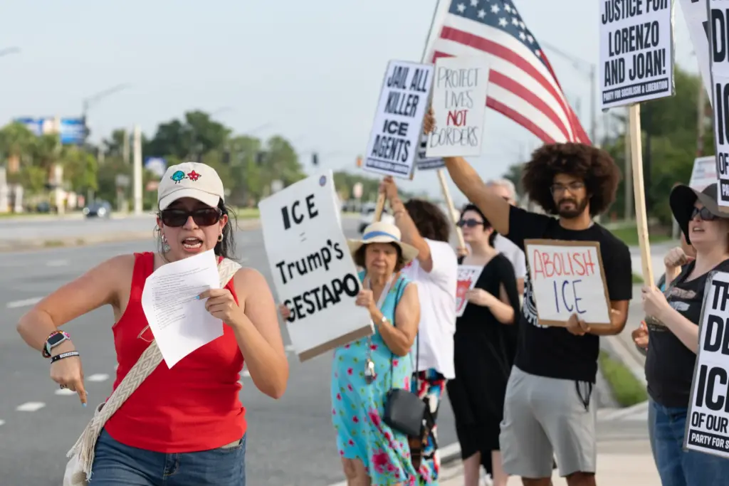 Protester leads the group chant during the Stop Ice Terror...