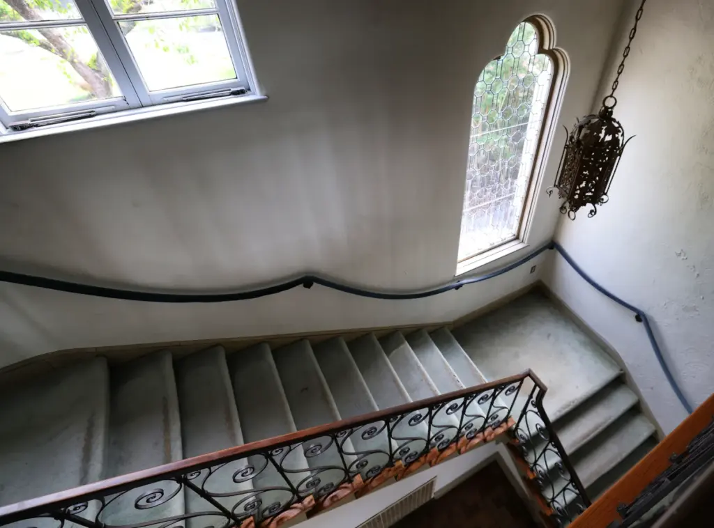 Carpeted stairs in Merrywood, the 7,300-square-foot, 3.7-acre estate designed by...
