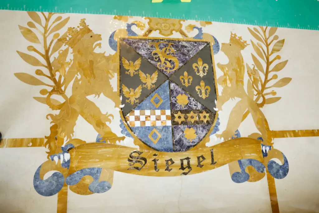 The custom Siegel family crest is inlaid directly into the...