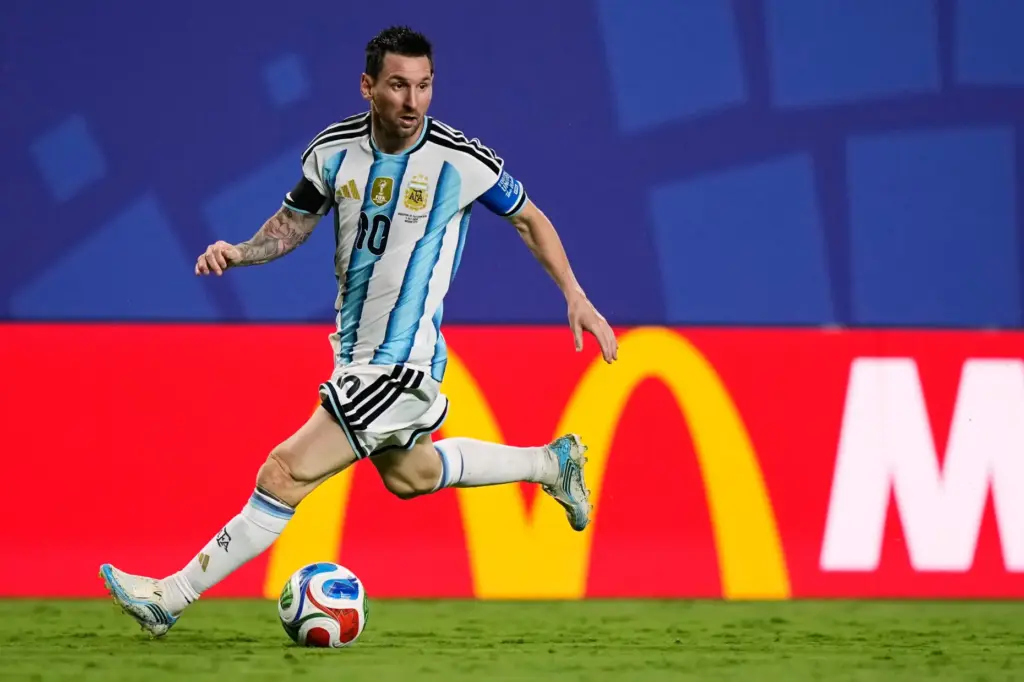 Argentina’s Lionel Messi (10) dribbles the ball during the World...