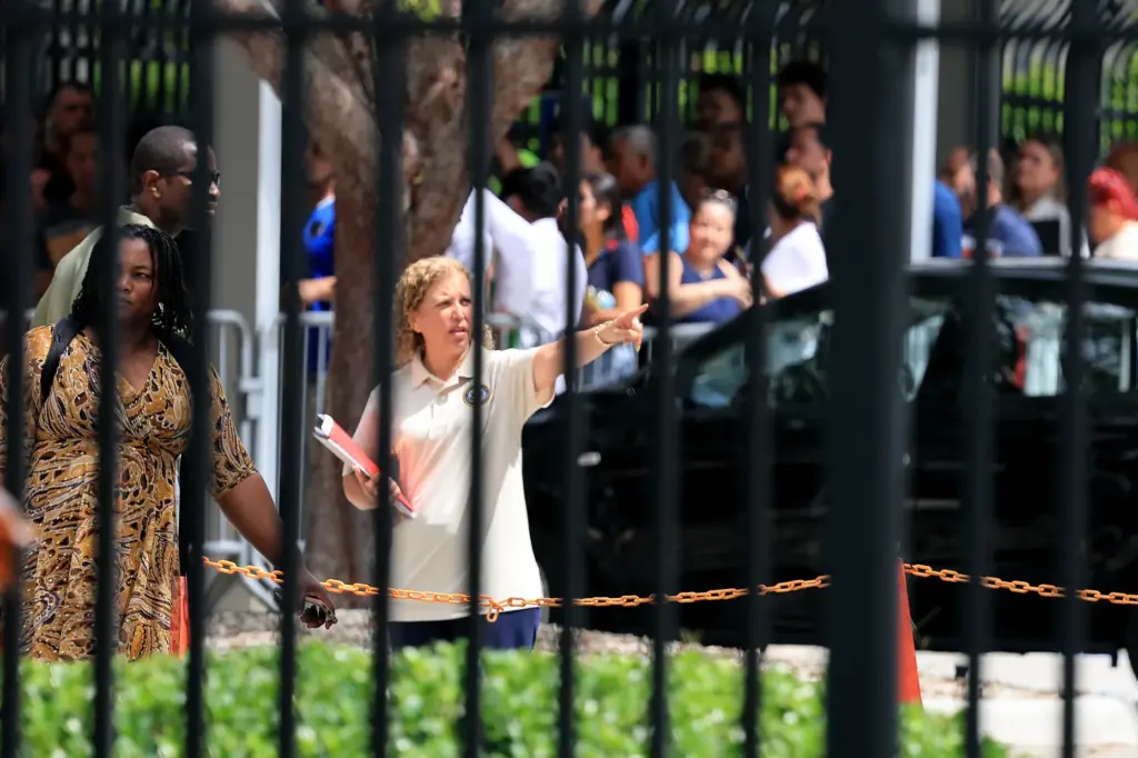 U.S. Rep. Debbie Wasserman Schultz talks to people inside the...