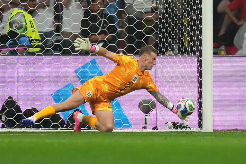 England goalkeeper Jordan Pickford saves a shot from Mexico’s Raul...