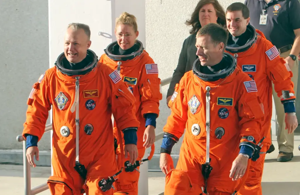 Space Shuttle Atlantis, STS-135, astronauts, from left to right, Pilot...
