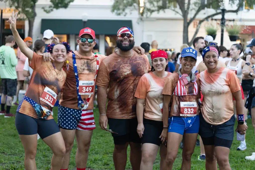 A group of runners in matching shirts before the Watermelon...
