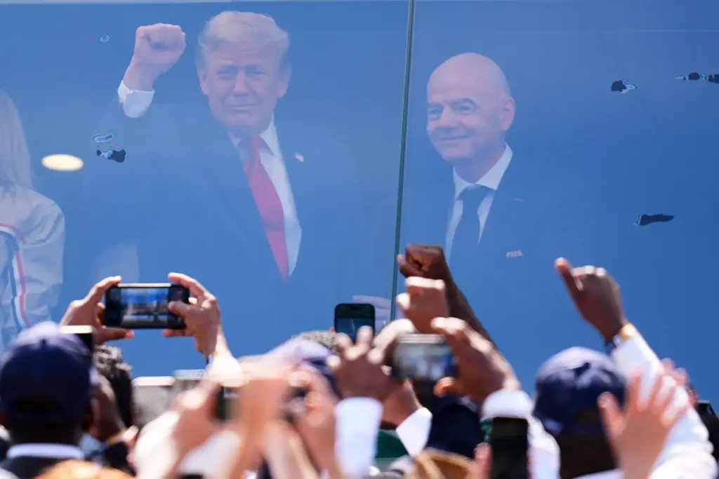 President Donald J. Trump stands with FIFA President Gianni Infantino...